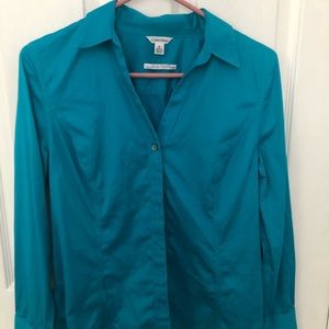 Women’s button down v-neck shirt. 2% spandex.